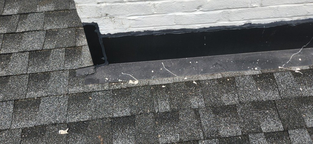 Chimney flashing repair at roofline